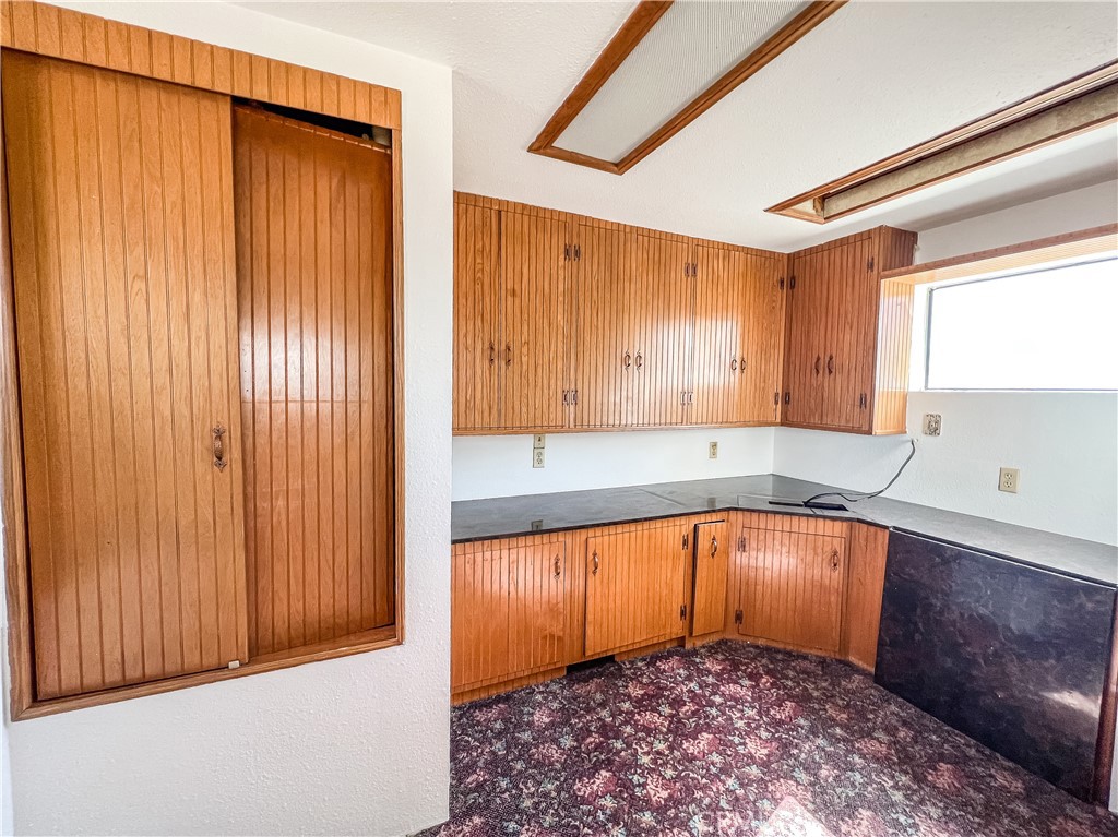 506 Desnok Street Needles, CA 92363 - Photo 47 of 70 a view of a kitchen with a sink and cabinets