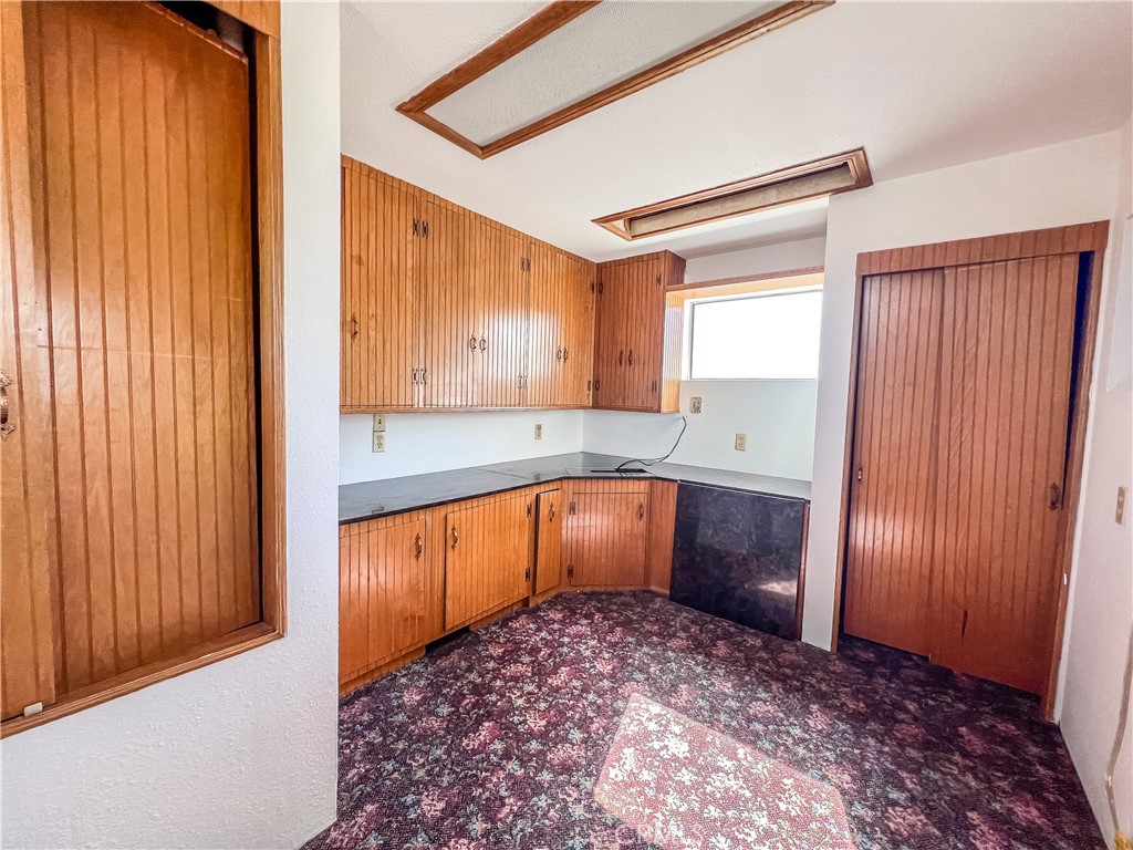 506 Desnok Street Needles, CA 92363 - Photo 48 of 70 a kitchen with a refrigerator sink and cabinets