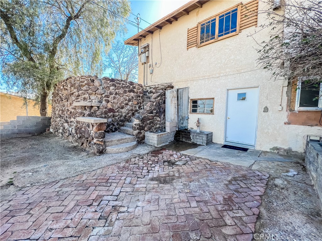506 Desnok Street Needles, CA 92363 - Photo 63 of 70 a view of a yard with a house
