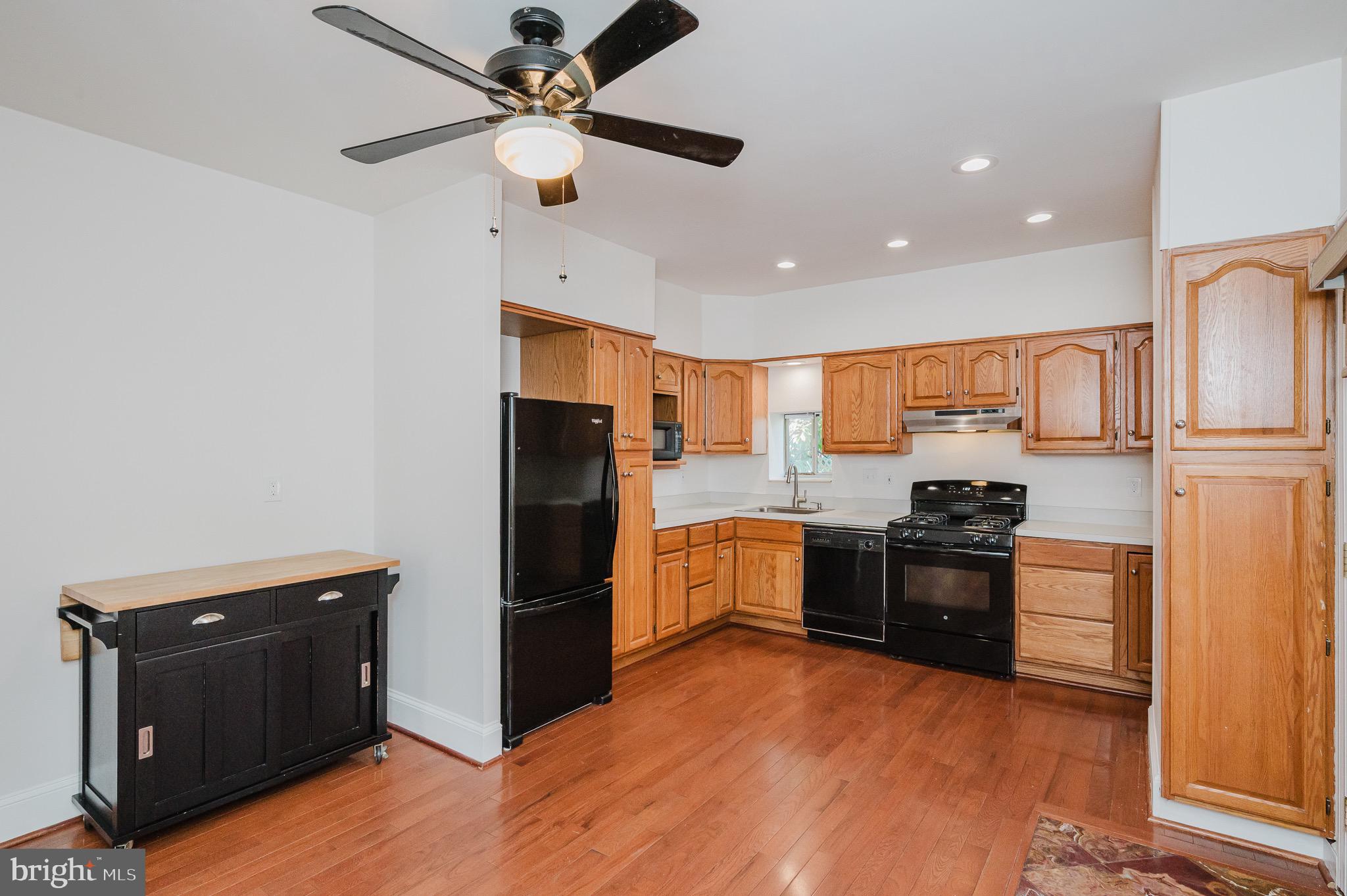 3518 Poole Street Baltimore, MD 21211 - Photo 16 of 59 a kitchen with stainless steel appliances granite countertop a refrigerator stove and oven