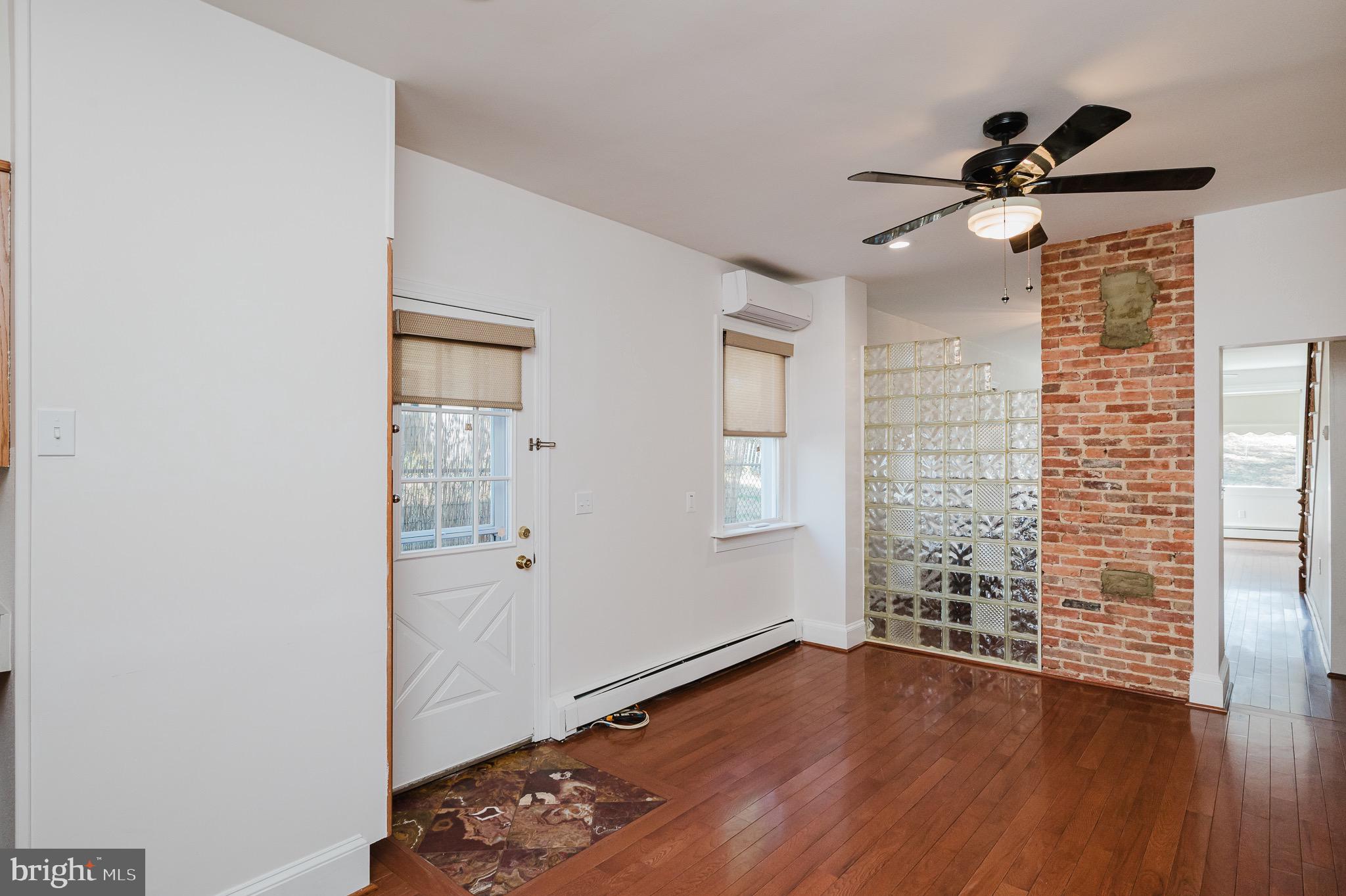 3518 Poole Street Baltimore, MD 21211 - Photo 26 of 59 a view of empty room with wooden floor