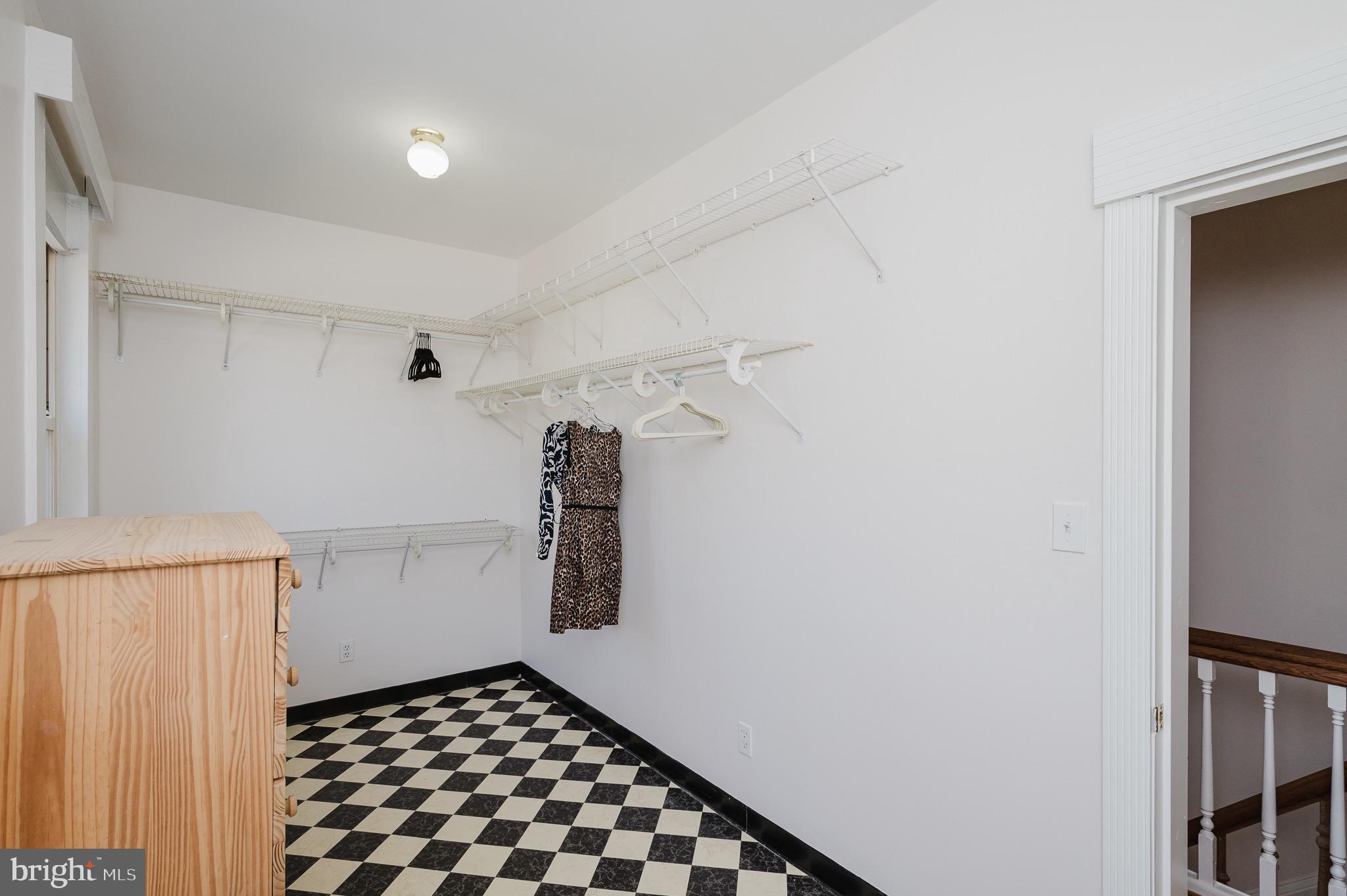 3518 Poole Street Baltimore, MD 21211 - Photo 27 of 59 a walk in closet with wooden floor