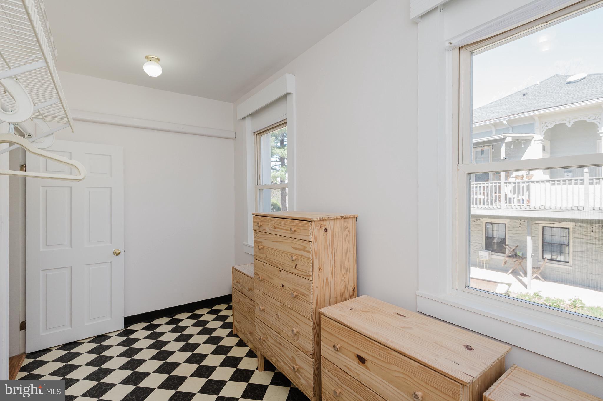 3518 Poole Street Baltimore, MD 21211 - Photo 28 of 59 a bedroom with a bed and a window
