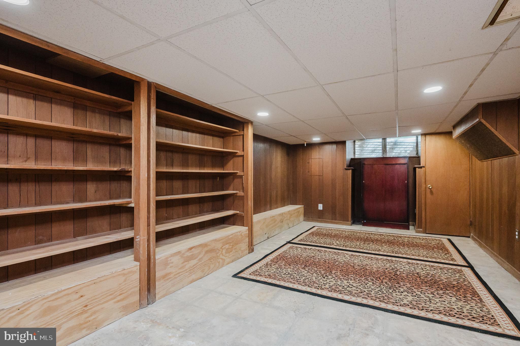 3518 Poole Street Baltimore, MD 21211 - Photo 33 of 59 a view of an empty room with a fireplace and a window