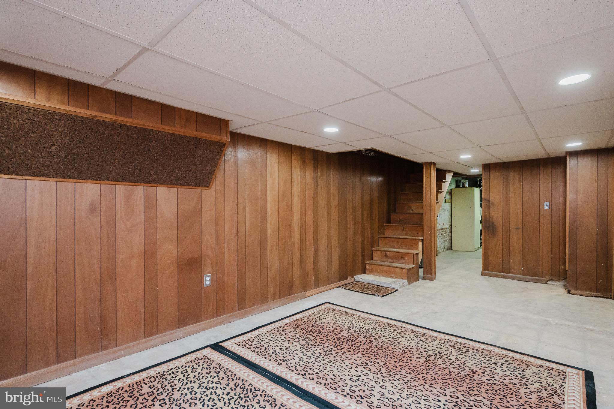 3518 Poole Street Baltimore, MD 21211 - Photo 36 of 59 a view of an empty room with wooden floor
