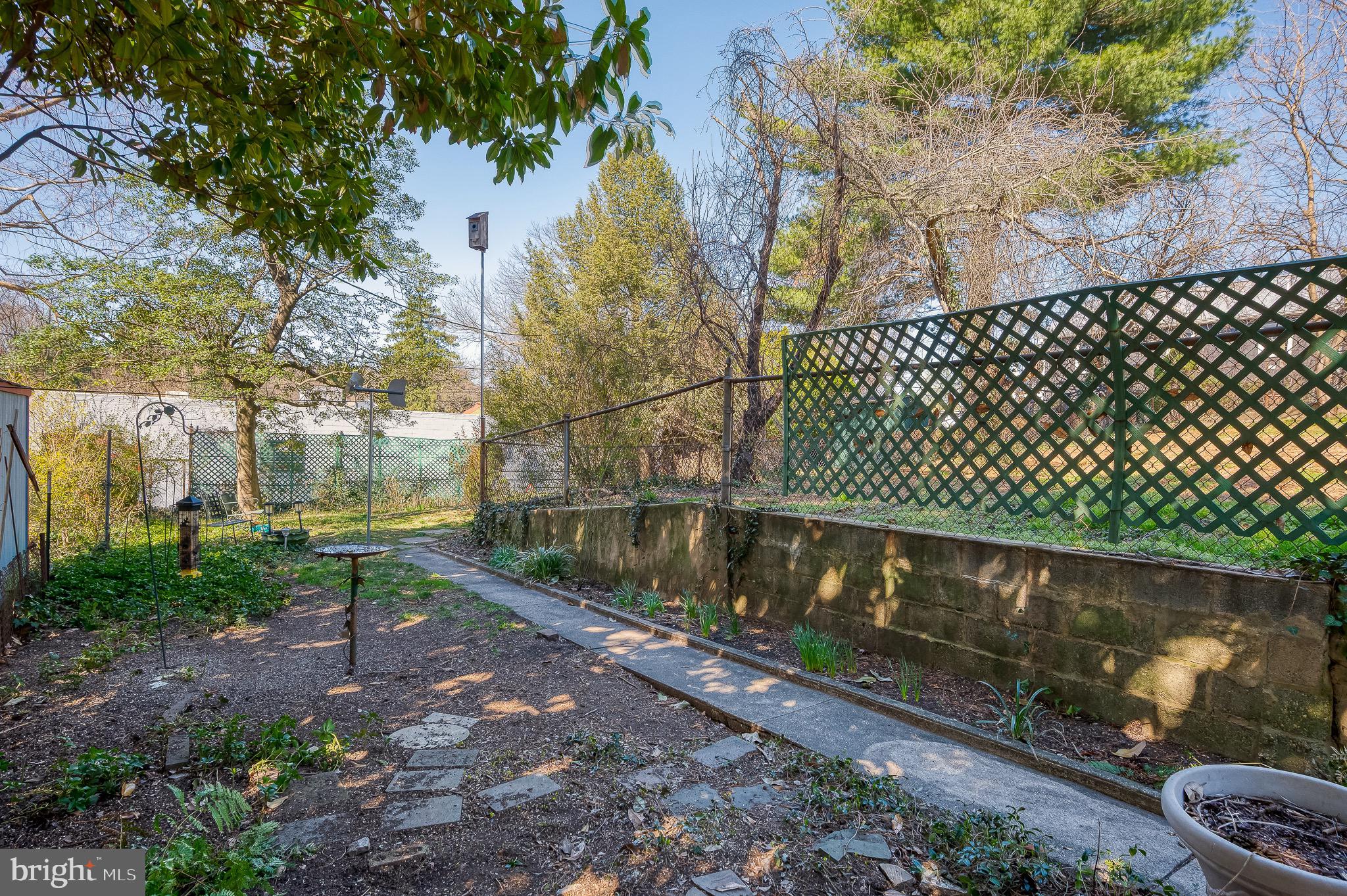 3518 Poole Street Baltimore, MD 21211 - Photo 46 of 59 a view of a street with wooden fence