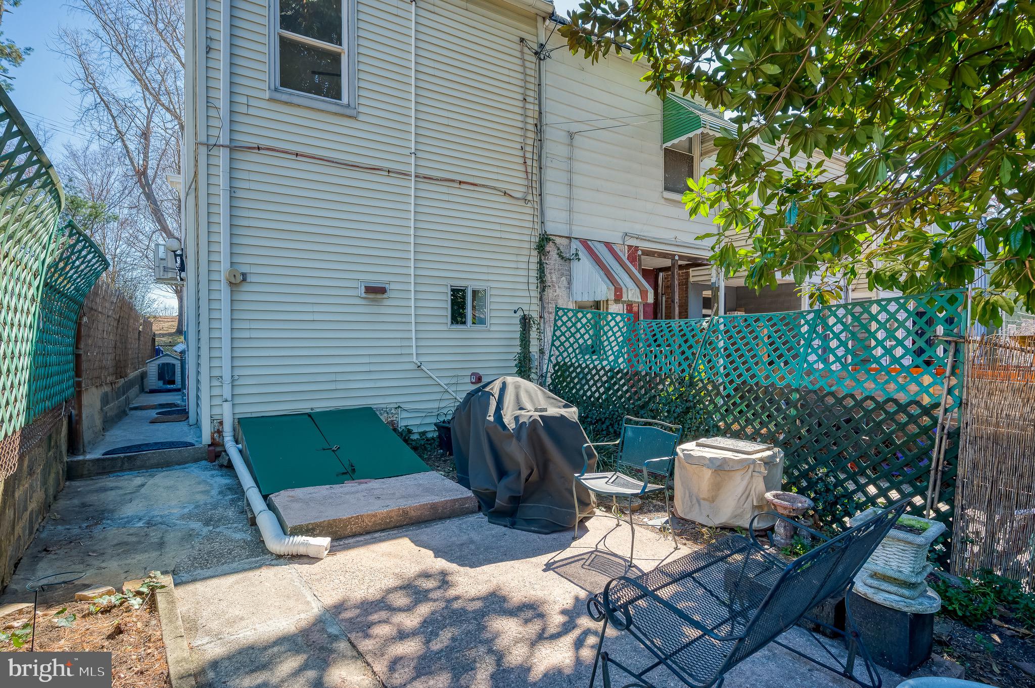 3518 Poole Street Baltimore, MD 21211 - Photo 47 of 59 a view of a chairs and table in backyard
