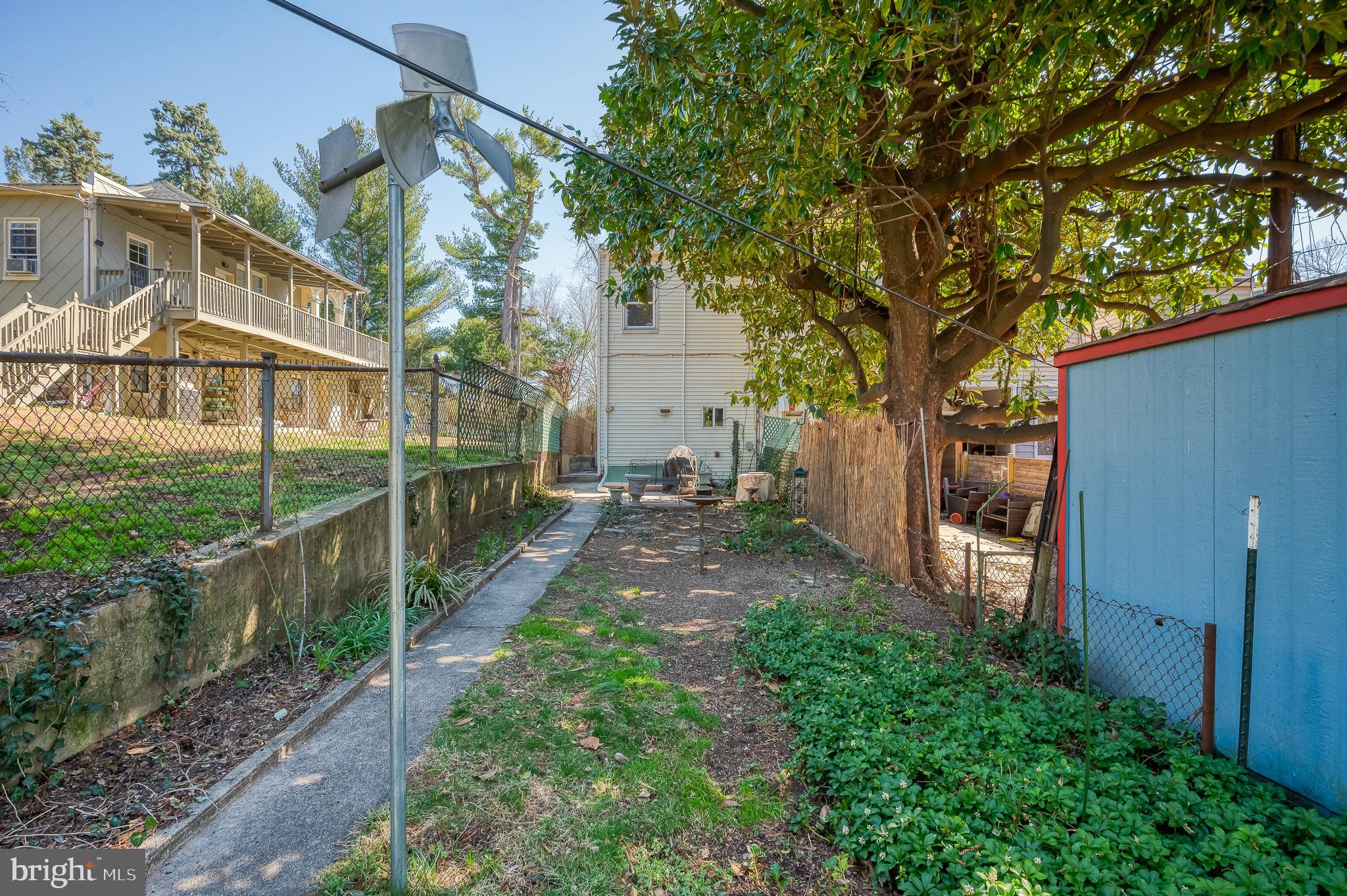 3518 Poole Street Baltimore, MD 21211 - Photo 49 of 59 a view of yard in front of house with trees