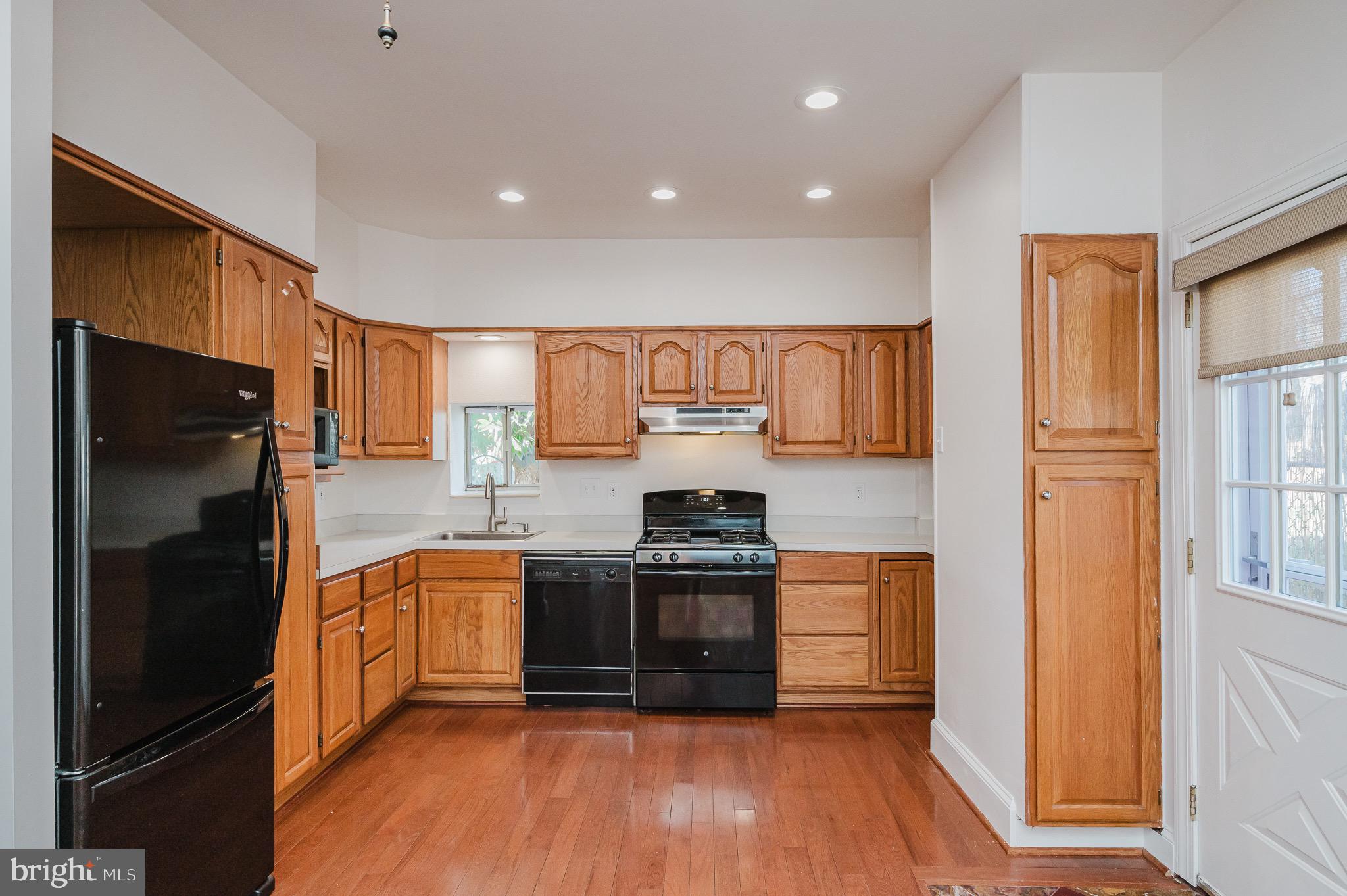 3518 Poole Street Baltimore, MD 21211 - Photo 8 of 59 a kitchen with stainless steel appliances granite countertop a refrigerator and a stove top oven