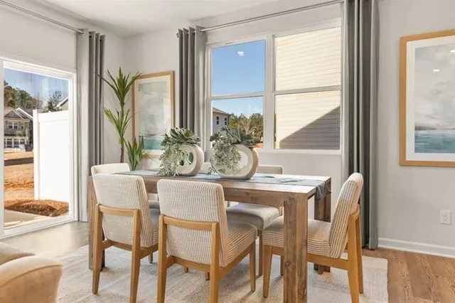 a dining room with furniture and window