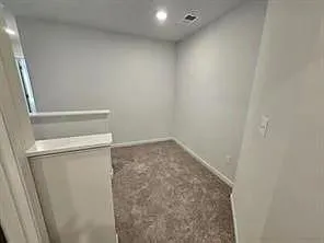 a view of a room with racks on the wall