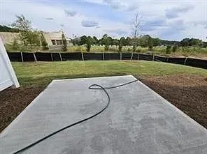 a view of a garden with a large trees