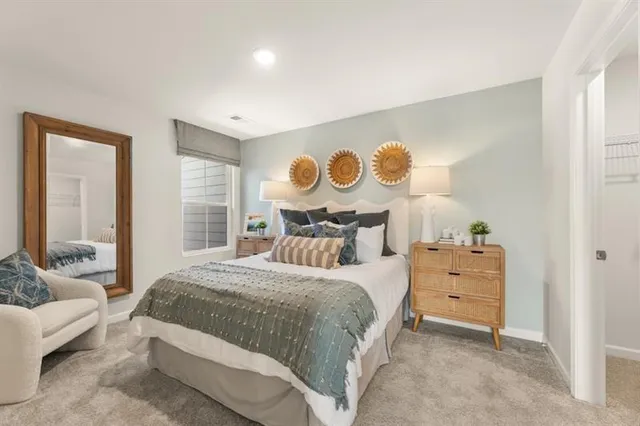 a bedroom with a bed and window