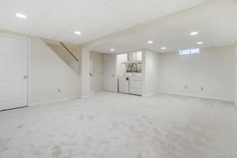 an empty room with a empty space and windows