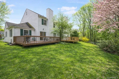 a view of a house with a back yard