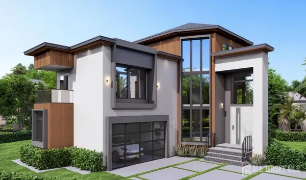 a front view of a house with a garden