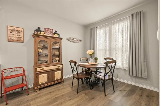 a kitchen with a sink appliances and a counter top space