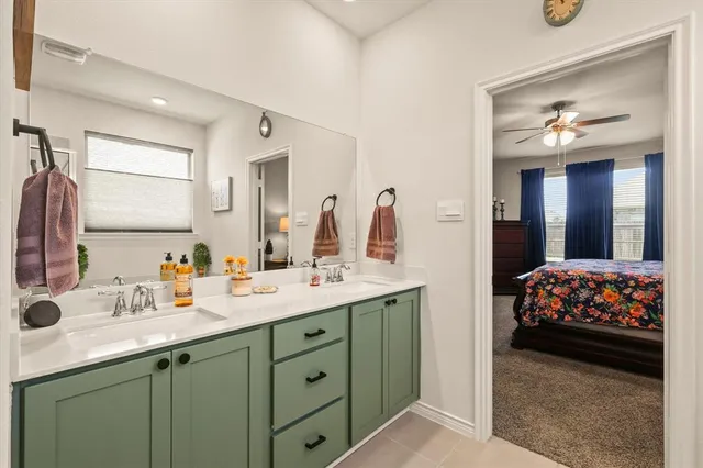 a bathroom with a tub a sink and glass door