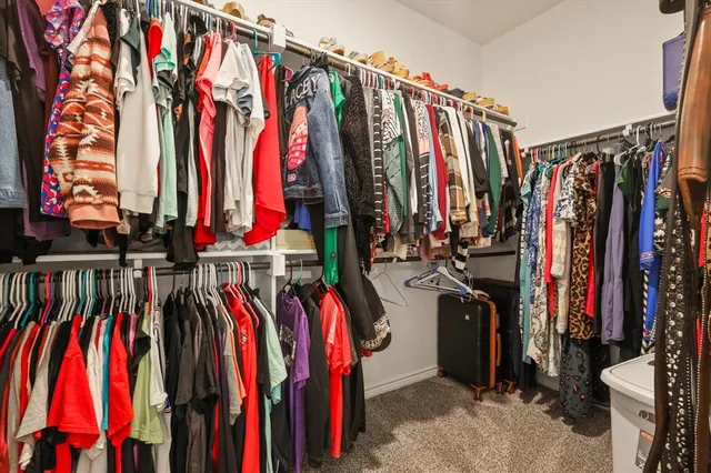 a en suite bathroom with a double vanity sink and a mirror