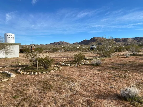 a view of a beach with a mountain in the background