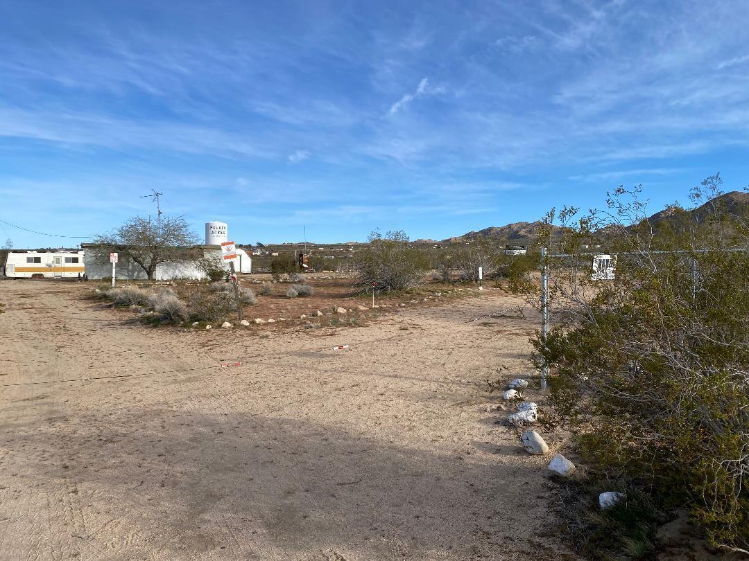 5457 Larrea Road Johnson Valley, CA 92285 - Photo 14 of 22 a view of a beach with a mountain in the background