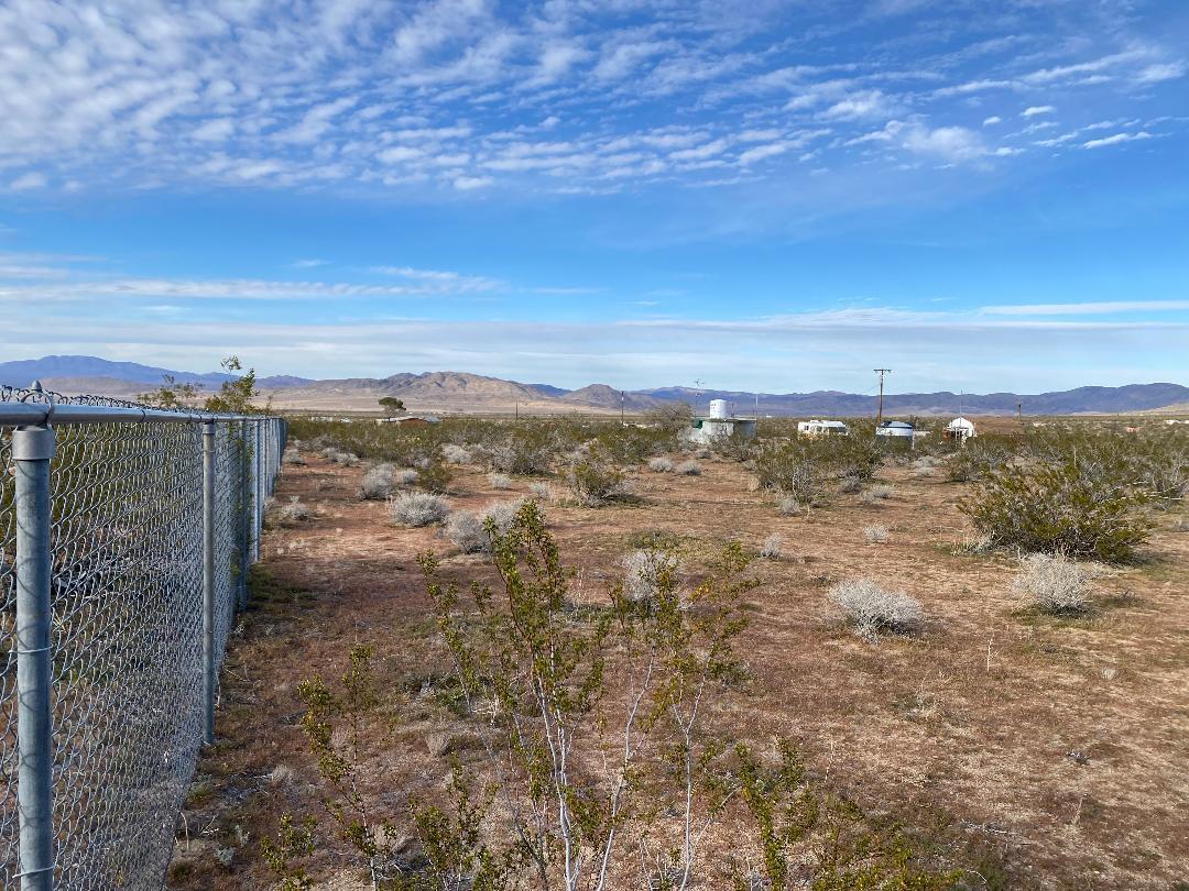 5457 Larrea Road Johnson Valley, CA 92285 - Photo 16 of 22 a view of an ocean beach and mountain