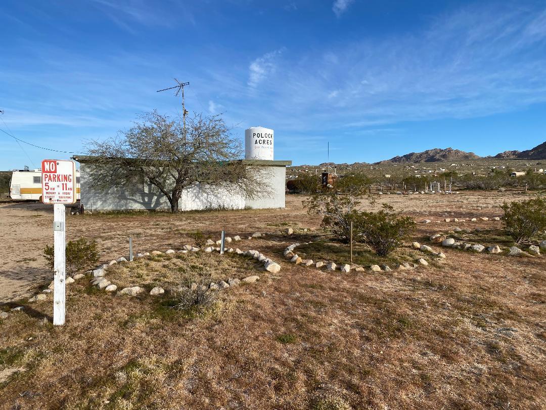 5457 Larrea Road Johnson Valley, CA 92285 - Photo 2 of 22 a view of a street with a building in the background
