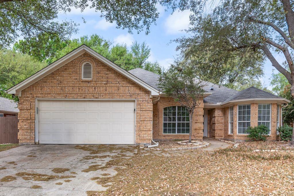 309 Austin Street Keller, TX 76248 - Photo 1 of 1 a front view of a house with a garden