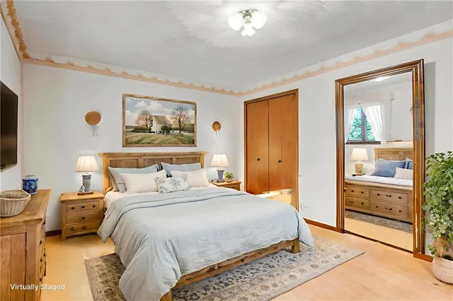 a bedroom with a bed and a cabinets