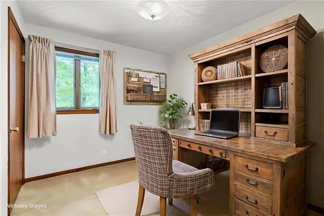 a dining room with furniture and a window