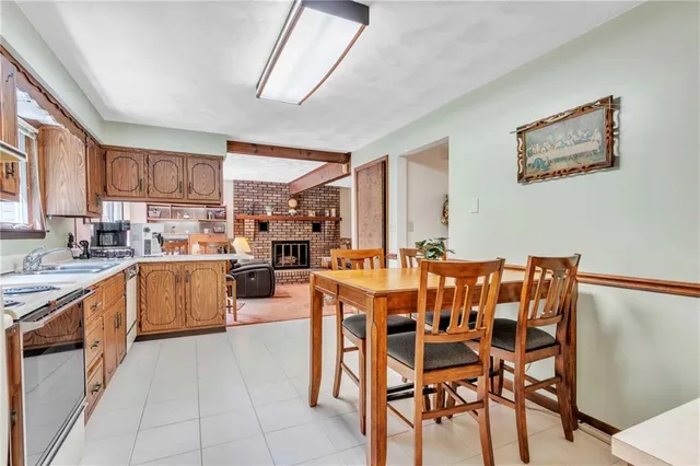 a large kitchen with a table and chairs