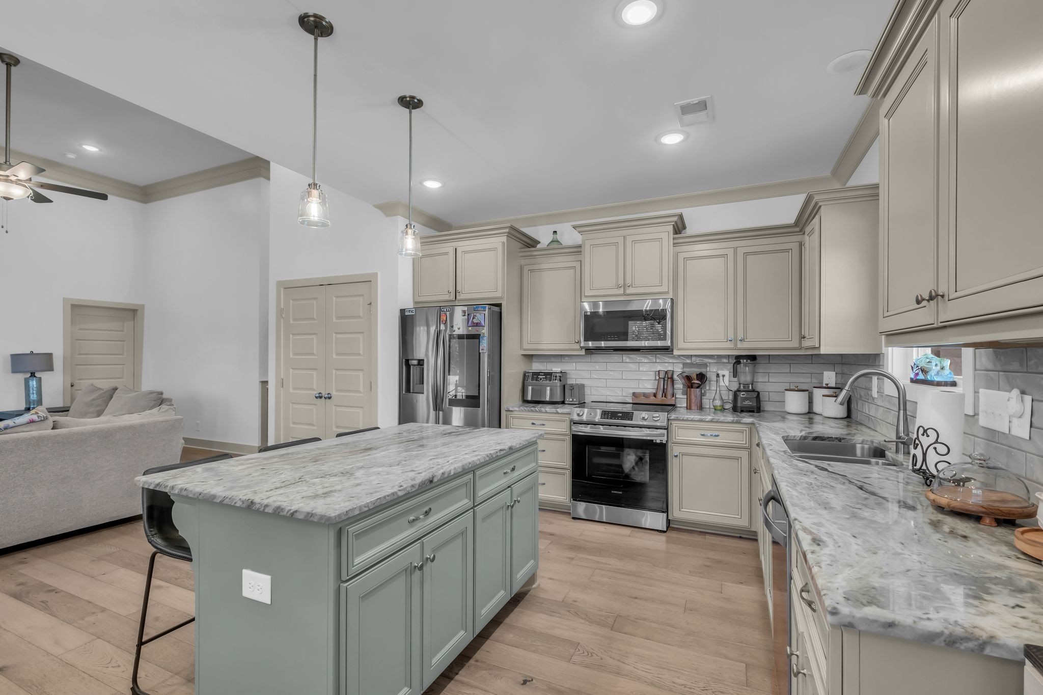 807 Ridgestone Place Lebanon, TN 37087 - Photo 12 of 34 a kitchen with stainless steel appliances granite countertop a sink stove and refrigerator