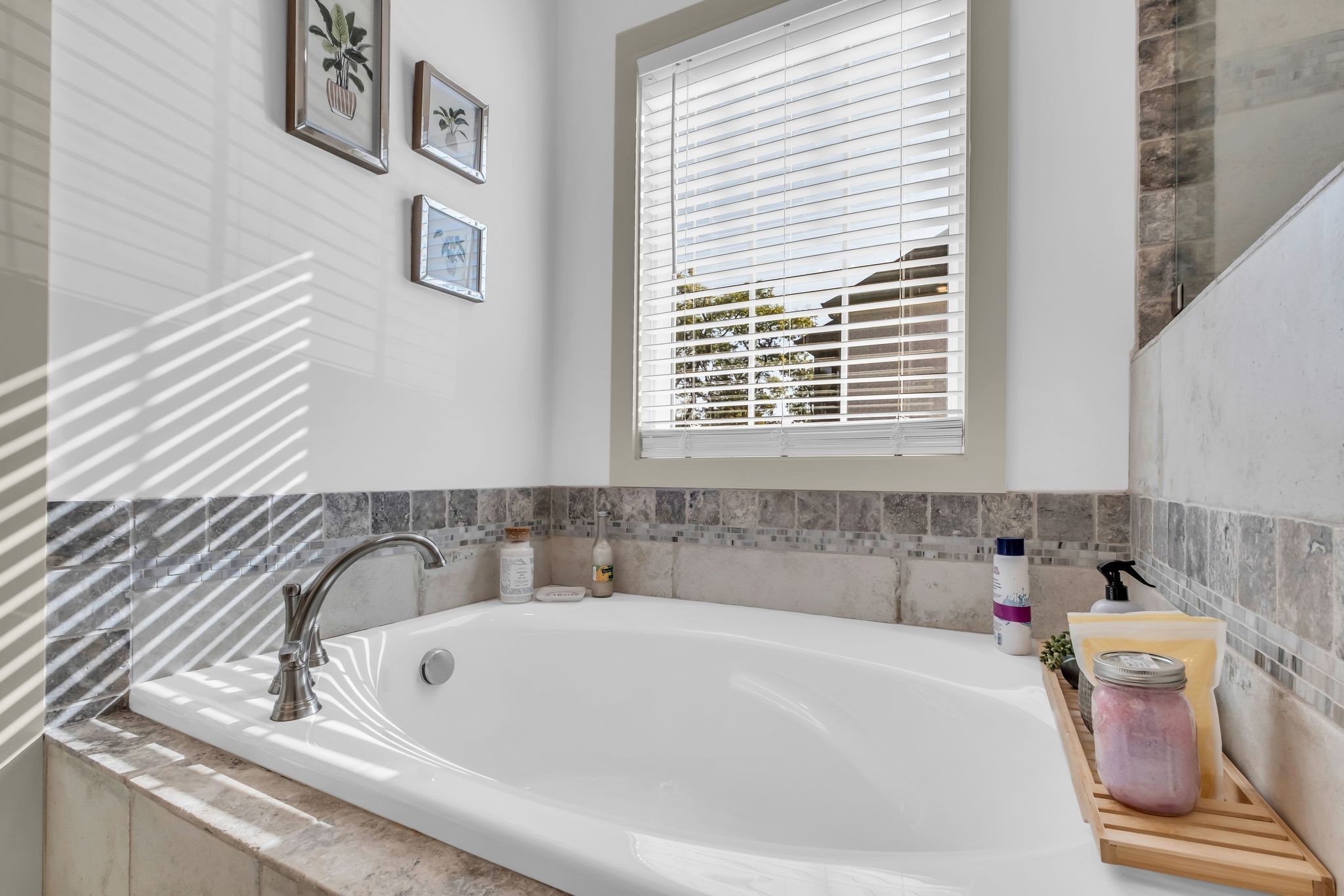 807 Ridgestone Place Lebanon, TN 37087 - Photo 19 of 34 a white bath tub sitting in a bathroom next to a window