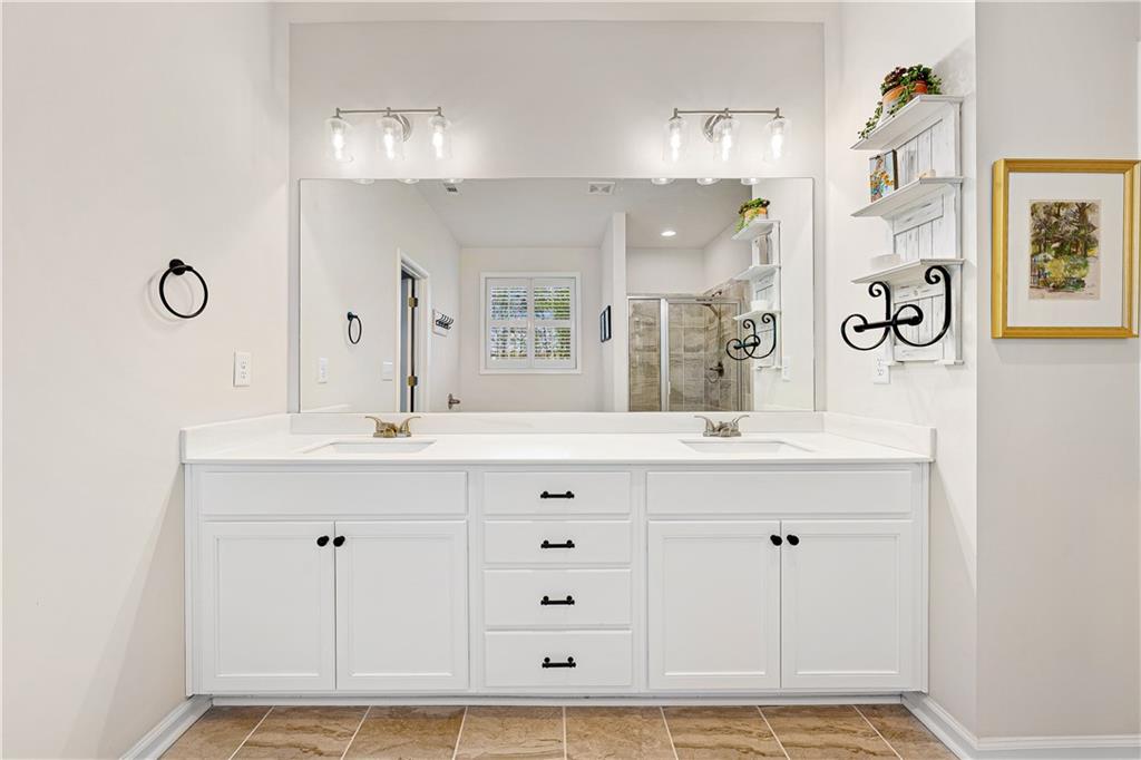 281 Greystone Court Winder, GA 30680 - Photo 32 of 71 a bathroom with mirror and a sink