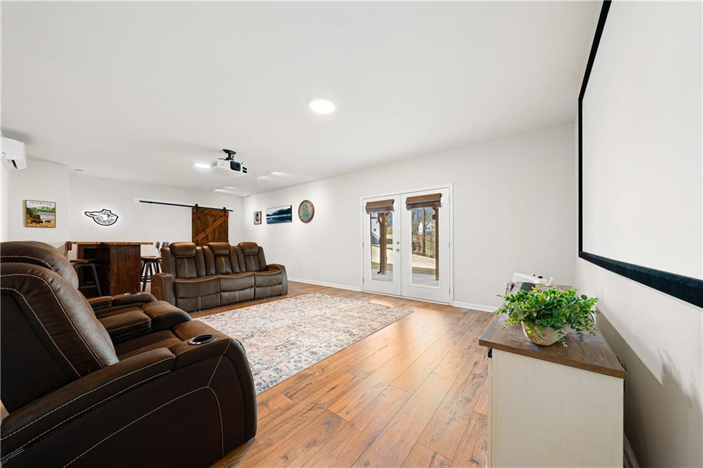 281 Greystone Court Winder, GA 30680 - Photo 44 of 71 a living room with furniture and a potted plant