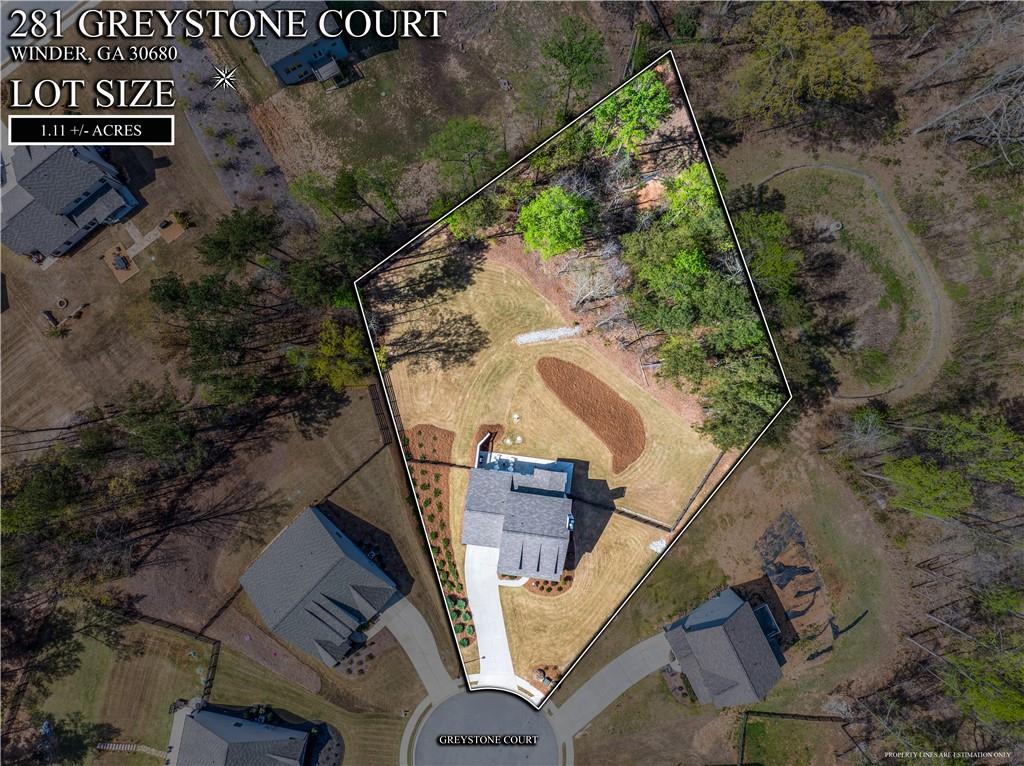 281 Greystone Court Winder, GA 30680 - Photo 64 of 71 an aerial view of a house with a yard