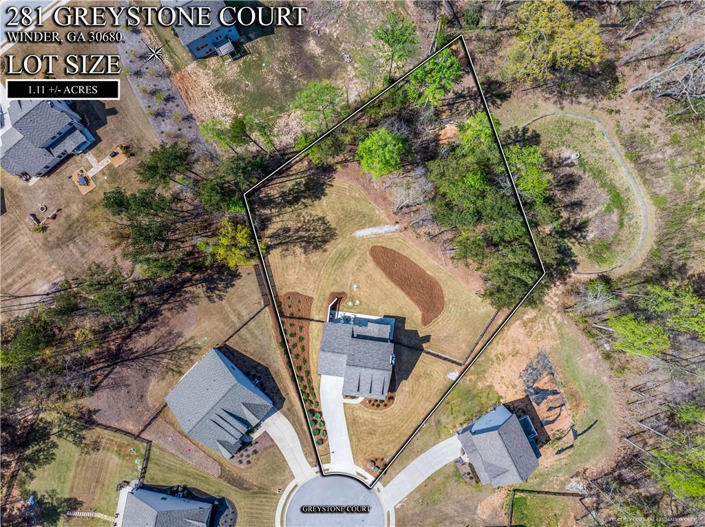 281 Greystone Court Winder, GA 30680 - Photo 65 of 71 an aerial view of a house with a yard