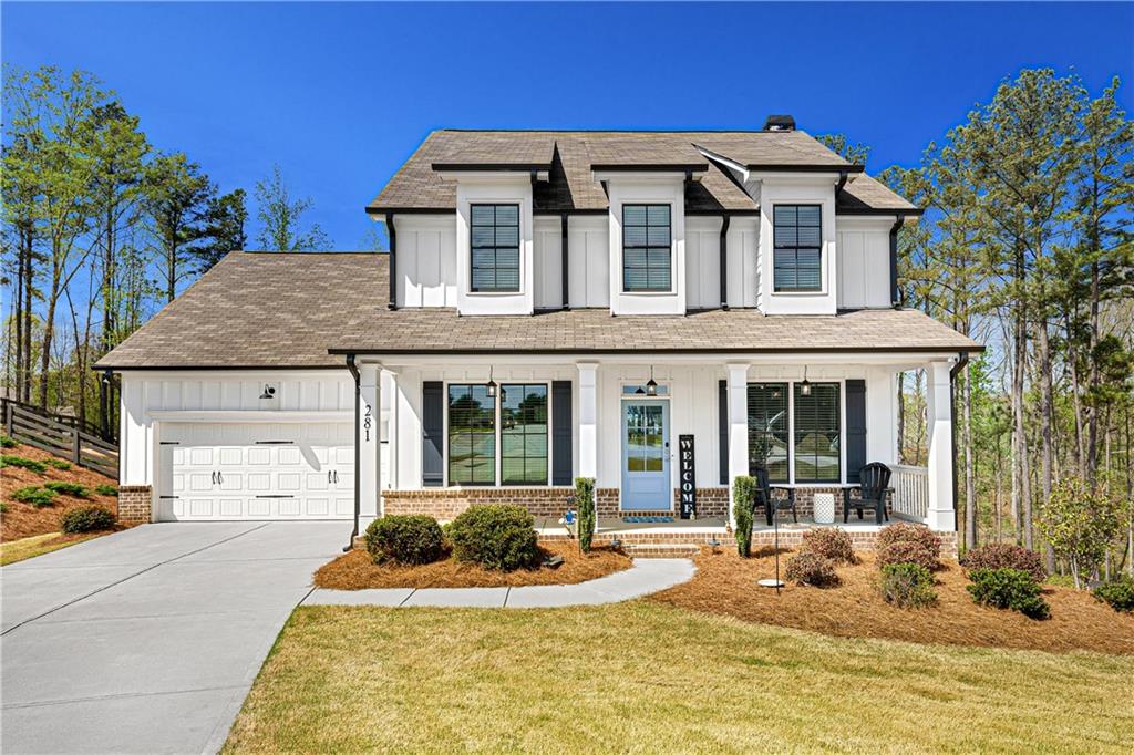 281 Greystone Court Winder, GA 30680 - Photo 68 of 71 a front view of a house with a yard table and chairs