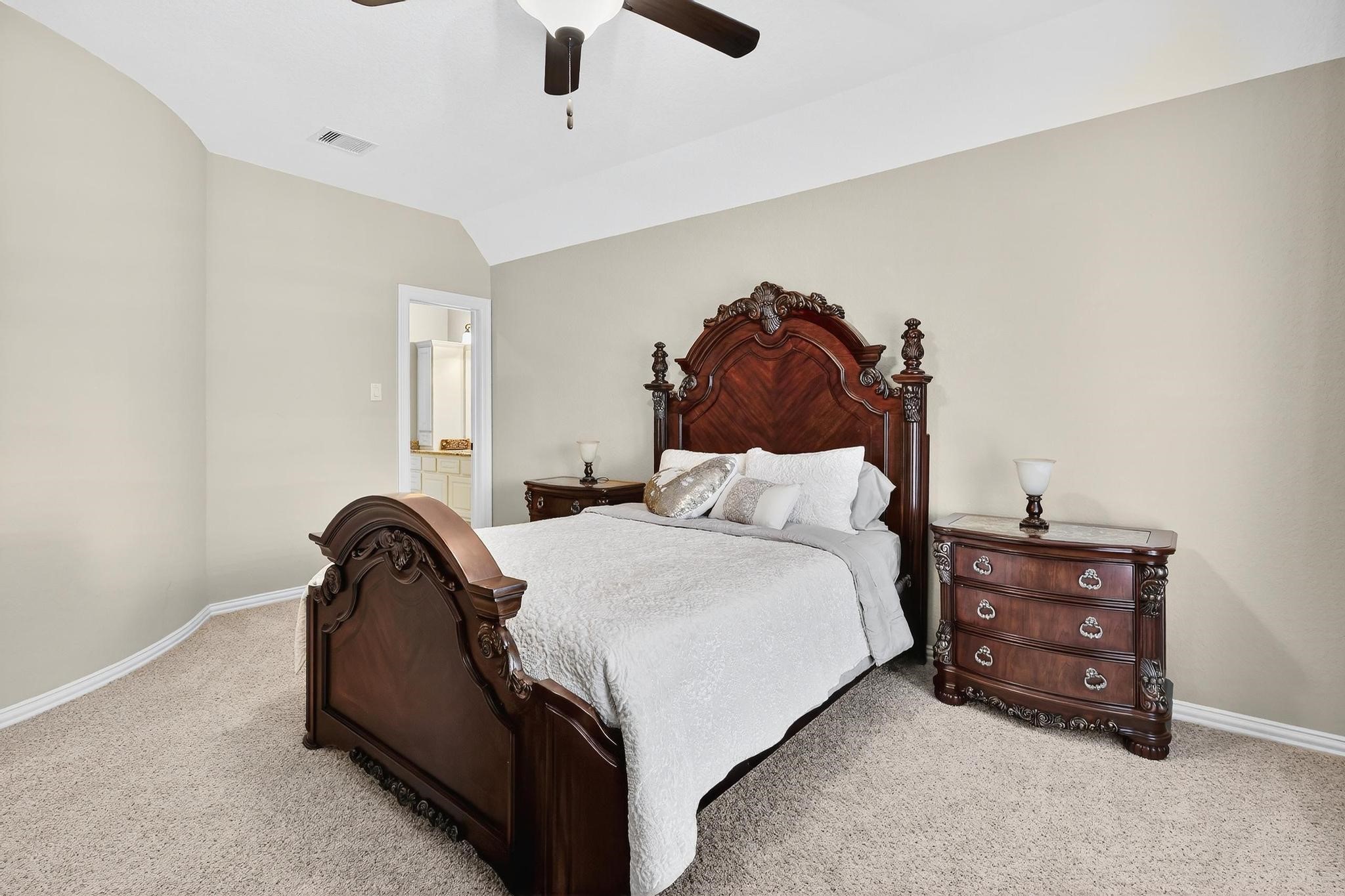 25803 Heritage Maple Drive Spring, TX 77389 - Photo 26 of 46 a bedroom with a bed and a ceiling fan