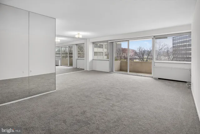 a view of an empty room with a window