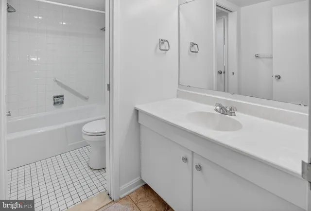 a bathroom with a sink toilet a shower and a mirror