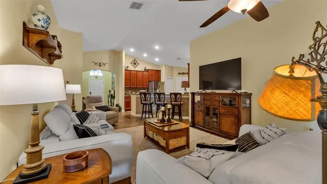 a bedroom with bed and a chandelier
