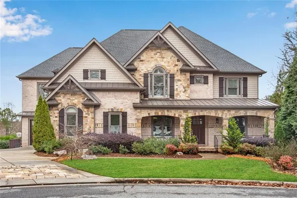a front view of a house with a yard