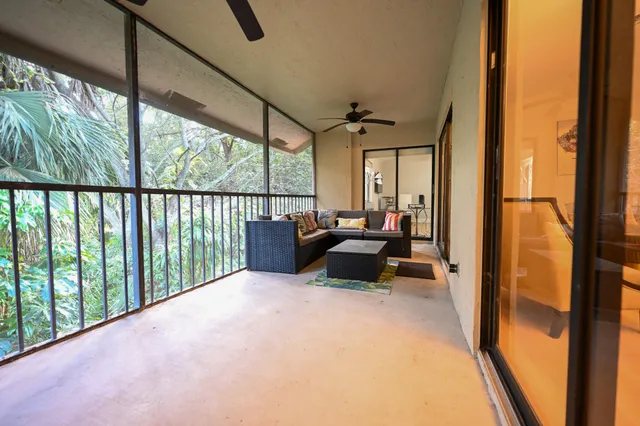 a bed room with a bed and a large window