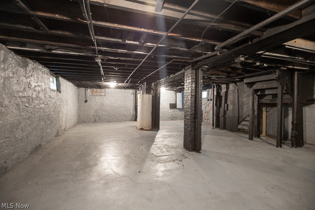 1892 Beersford Road Cleveland, OH 44112 - Photo 42 of 47 Basement featuring water heater and electric panel