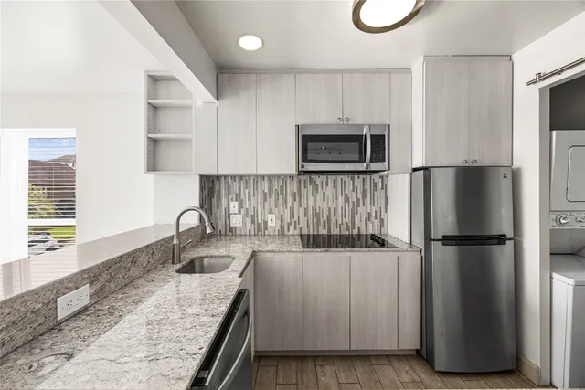 a kitchen with a refrigerator sink and microwave