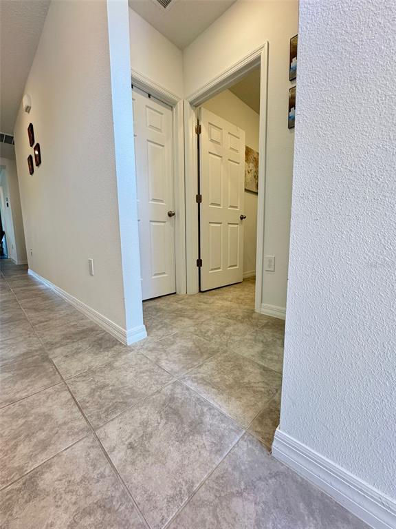 4836 Rigging Street Haines City, FL 33844 - Photo 15 of 29 an empty room with an entryway door