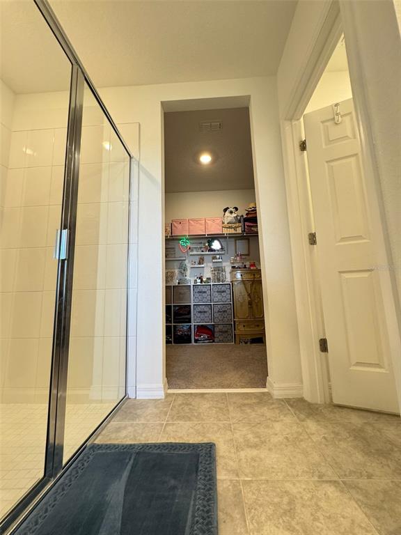4836 Rigging Street Haines City, FL 33844 - Photo 17 of 29 a view of a hallway with wooden floor and staircase