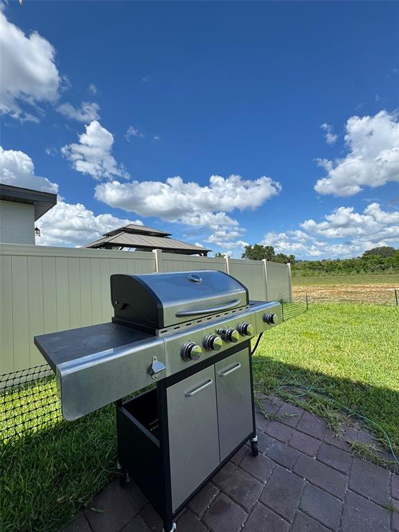 4836 Rigging Street Haines City, FL 33844 - Photo 25 of 29 a view of a chairs and table on the terrace