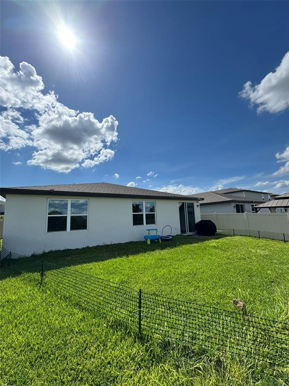 4836 Rigging Street Haines City, FL 33844 - Photo 27 of 29 a house view with a garden space
